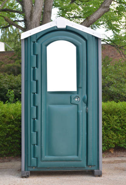 Blue mobile toilet cabin in a park